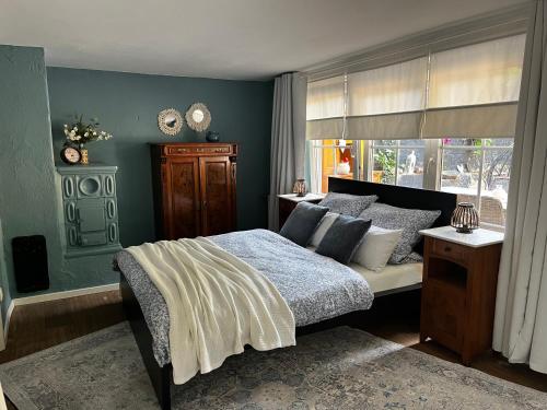a bedroom with a bed and a window at Ferienwohnung Terrassenblick in Zülpich