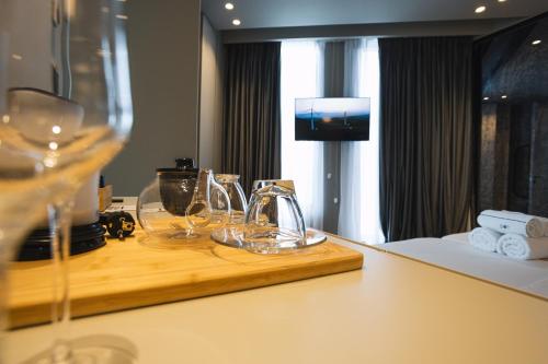 a hotel room with a counter with glasses on it at Dot Tradition in Vlorë