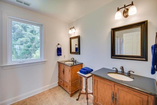 a bathroom with a sink and a mirror at Gloucester Point Vacation Rental on York River! in Yorktown