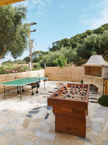 a ping pong table and a ping pong table at Country House DAFNI with his pets in Vasilikos