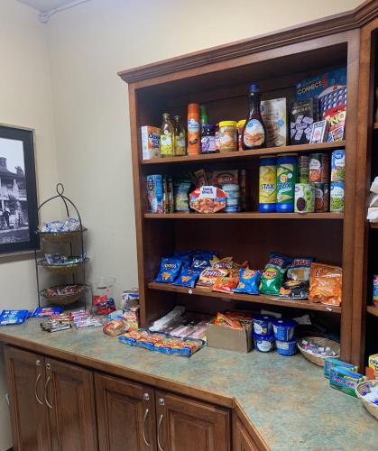 a pantry with a counter with food on it at MainStay Suites St Robert - Fort Leonard Wood in Saint Robert