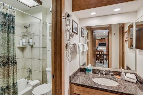 a bathroom with a sink and a toilet and a shower at Laurelwood Condominiums 408 in Snowmass Village