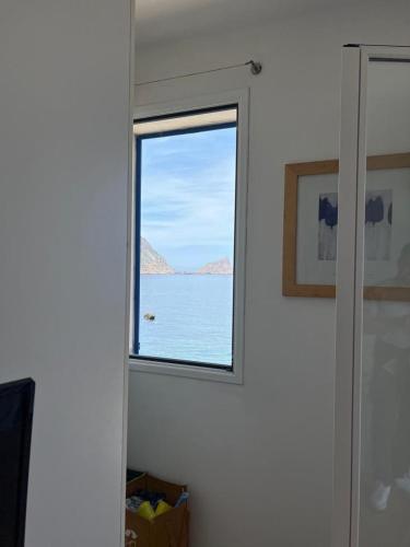 a window in a room with a view of the ocean at Albamare apartment in Marettimo