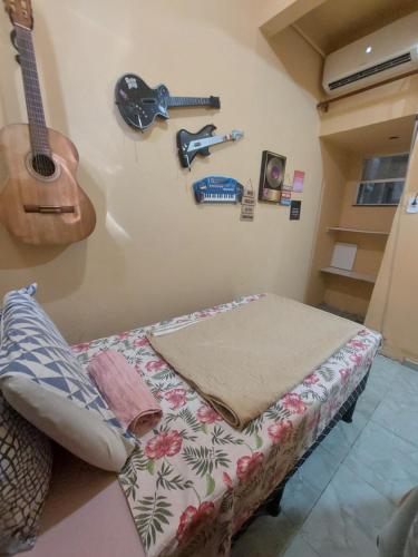 Uma cama ou camas num quarto em Pousada Cantinho da Família