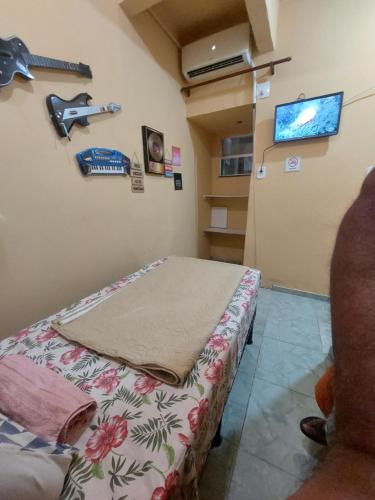 Et tv og/eller underholdning på Pousada Cantinho da Família