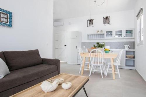 a living room with a couch and a table at Bella vista Suites in Karpathos Town
