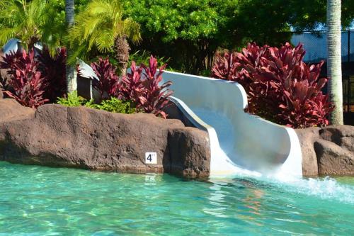 a water slide in a pool at a resort at Kuhio Shores 316 in Koloa