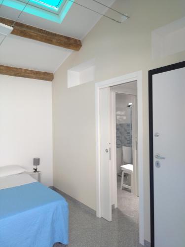 a bedroom with a bed and a skylight at LA REGGIA APARTMENTS MILAZZO in Milazzo