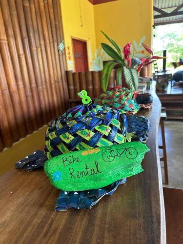 a table with a cake on top of a table at Luminosa Uvita Hostel in Uvita