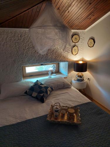 a bedroom with a bed with clocks on the wall at Blue in Pula