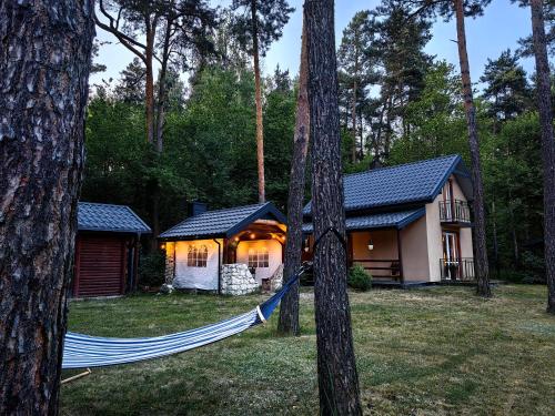 Kajaki wino i śpiew - domek z sauną w otoczeniu lasów i sąsiedztwie zalewu