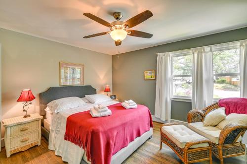 a bedroom with a bed and a ceiling fan at Cute Downtown Conway Duplex - 15 Mi to Beach! in Conway