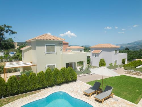 Výhľad na bazén v ubytovaní Vasilopoulos Residences - Villa Anthia with jacuzzi & shared pool alebo v jeho blízkosti