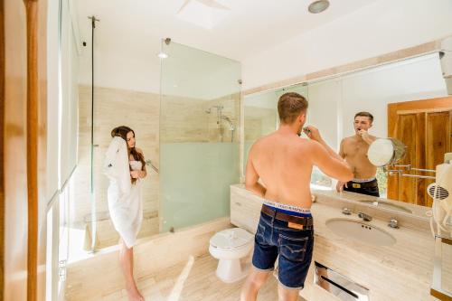 a group of people standing in a bathroom at Uxmal Resort Maya in Uxmal