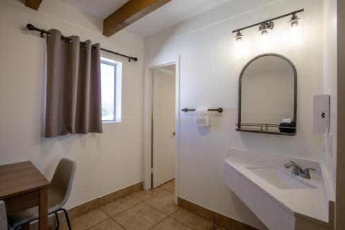 a bathroom with a sink and a mirror at Dreamcatcher Inn of Sedona in Sedona