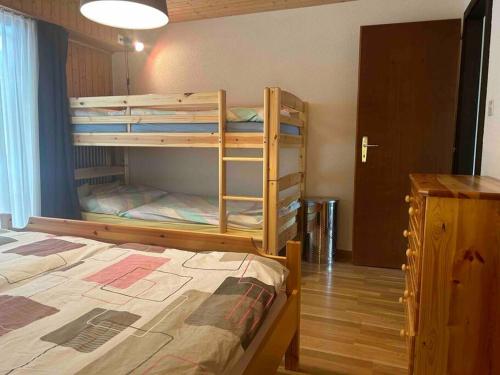 a bedroom with two bunk beds and a bed at Appartement Haute-Nendaz in Nendaz