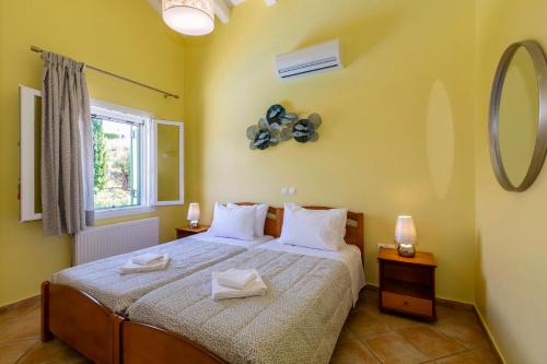 Ένα ή περισσότερα κρεβάτια σε δωμάτιο στο Villa Charchala