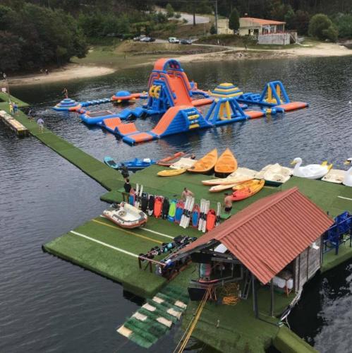 a water park with a water slide in the water at Casa das Lages in Vieira do Minho