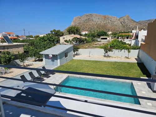 a swimming pool on the roof of a house at Villa Sakrakis seaview villa in Stavros