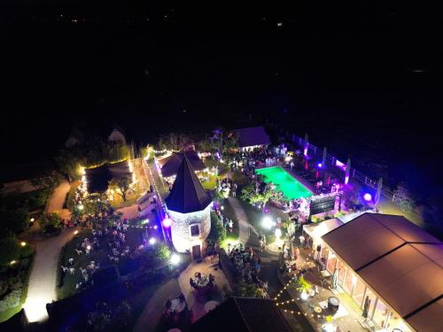 an overhead view of an outdoor event at night at Domaine de Suzel in Vignieu