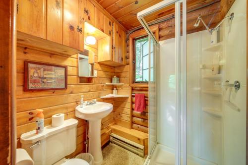 a bathroom with a shower and a toilet and a sink at Waterfront Newport Vacation Rental on Sacheen Lake in Newport