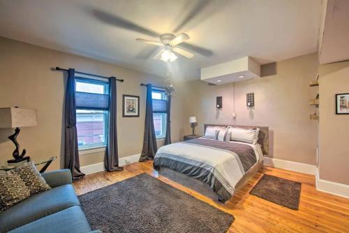 a bedroom with a bed and a ceiling fan at Contemporary Townhome in Midtown Harrisburg! in Harrisburg