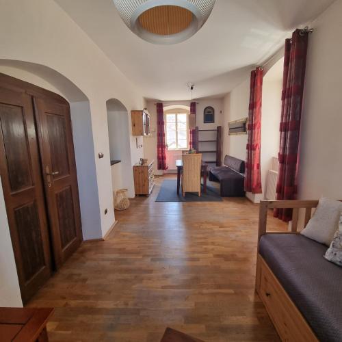 a living room with a couch and a table at Vila Lucia - Apartmán 3 in Plzeň