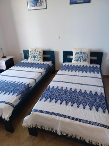 Postel nebo postele na pokoji v ubytování LALAROUS Studios & Apartments