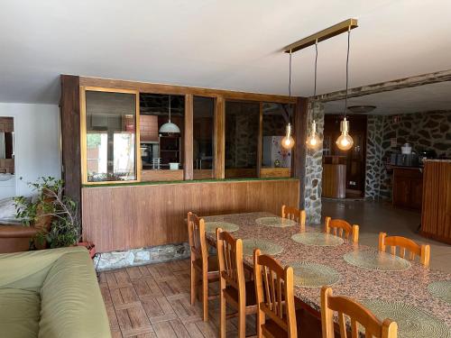 a dining room with a table and chairs at La Cigarrita Guest House - Douro Valley in Peso da Régua