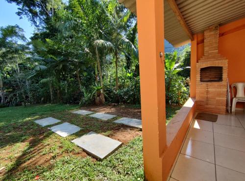 a view of a garden from the porch of a house at Chalés Bela Vista in Paraty