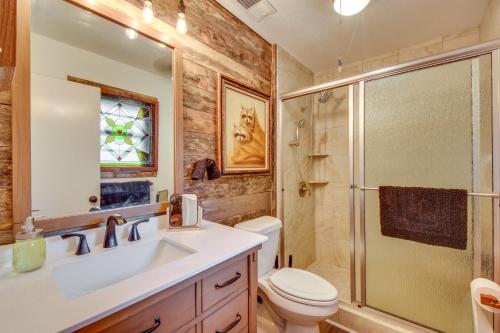 a bathroom with a sink and a shower and a toilet at Whimsical Athens Home - 3 Mi to Sanford Stadium in Athens
