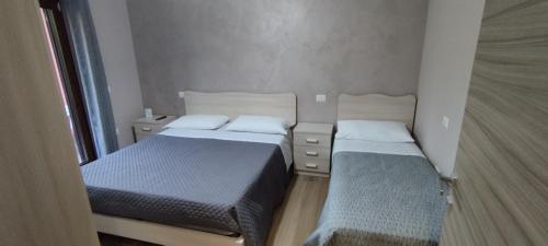 Ένα ή περισσότερα κρεβάτια σε δωμάτιο στο B&B Casa Barone