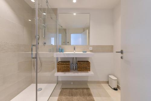 a bathroom with a sink and a shower at SolMalaga SeaView Pool & Parking in Fuengirola