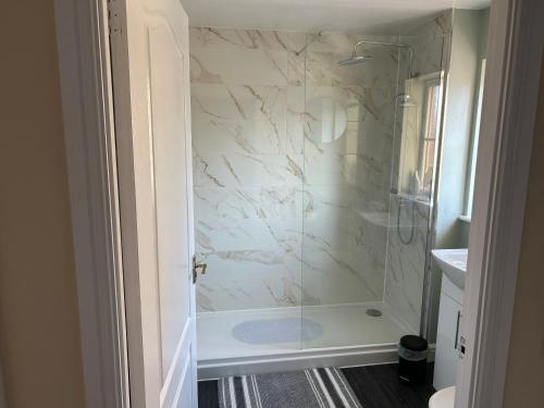 a bathroom with a shower and a sink at Luxury Town Centre Apartment in Ipswich