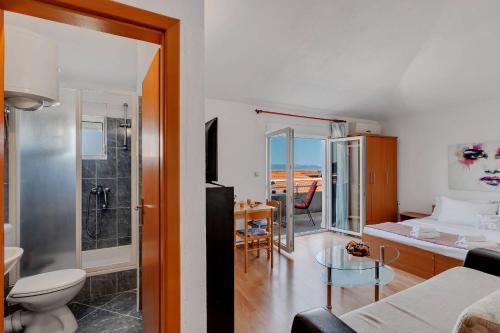 a living room with a toilet and a bathroom at Residence Apartments in Makarska