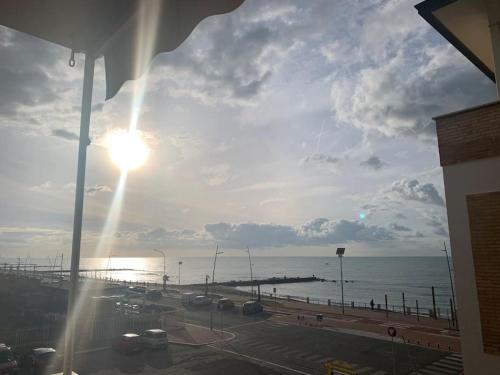 a view of the ocean and a parking lot at Rome's Harbour all year in Lido di Ostia
