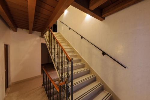 a staircase in a house with a wooden ceiling at Cà Sant'Angelo in Venice