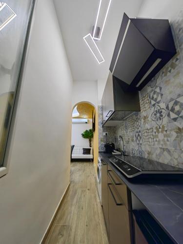 a kitchen with a sink and a counter top at La suite (Sole) in Lido di Pomposa