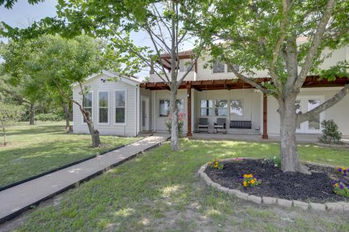 a home with a yard with trees and flowers at Private Pool and Guest House Spacious Kemp Home! in Kemp