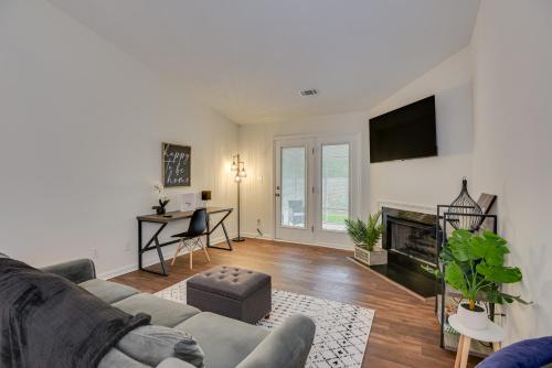 a living room with a couch and a tv at Serene Sanctuary Near I-20 in Augusta