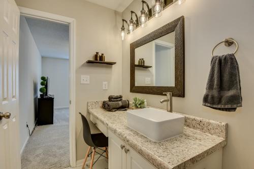 a bathroom with a sink and a mirror at Serene Sanctuary Near I-20 in Augusta