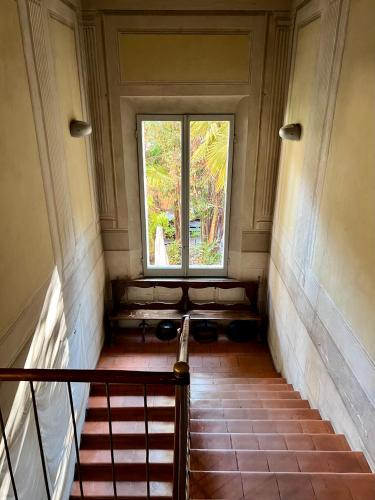 a staircase with a window in a building at a casa di paola in Ravenna
