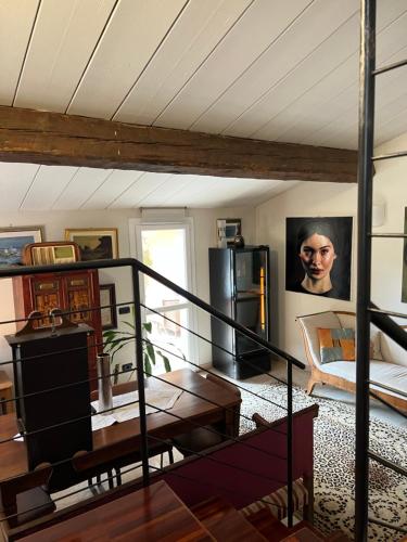 a living room with a spiral staircase in a house at a casa di paola in Ravenna