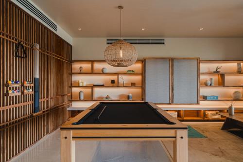 a ping pong table in a room with shelves at Nobu Hotel Los Cabos in Cabo San Lucas