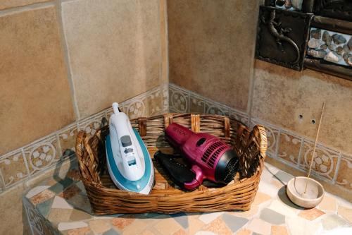 a basket of items sitting on a counter in a bathroom at Sunshine House - Made by artists in Oaxaca City
