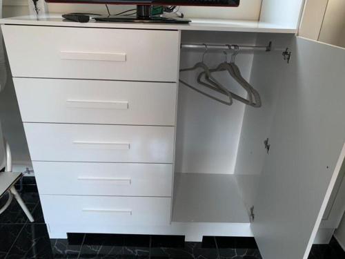 a white desk with drawers in a kitchen at KITNET MOBILIADA - PENHA in Rio de Janeiro