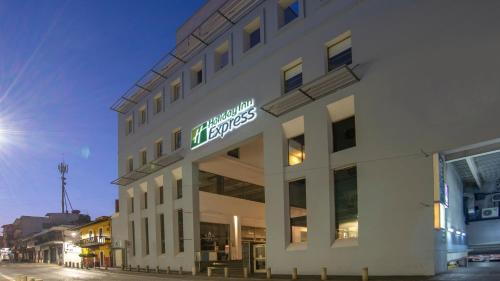 a building with a sign on the side of it at Holiday Inn Express Xalapa, an IHG Hotel in Xalapa