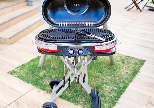 a grill sitting on top of a patch of grass at Hotel California Miyakojima Resort in Miyako Island