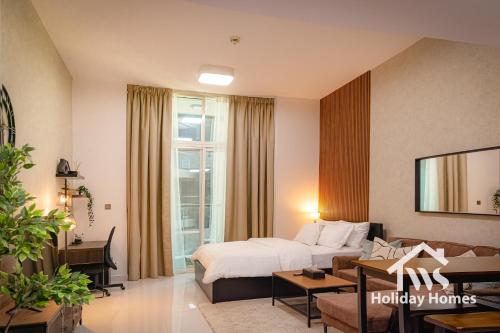 a hotel room with a bed and a living room at The Urban Oasis - Serenity in Dubai