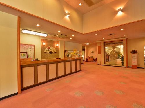 a large lobby with a bar in the middle at Fudouonsen Sawaya in Shimojo mura